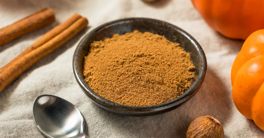 Pumpkin pie spices with cinnamon, nutmeg, and pumpkins for autumn homebrewing