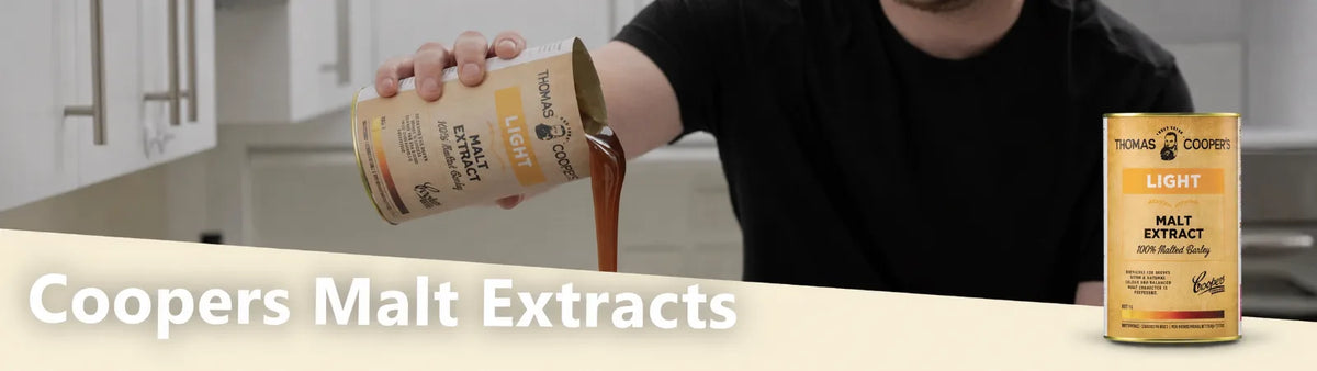 Coopers Malt Extracts light malt extract can being poured in a kitchen