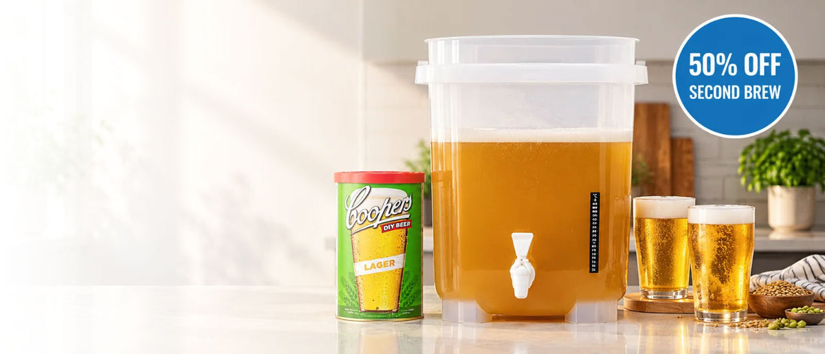 Coopers DIY 5-gallon fermenter with Lager refill and two glasses of beer, promoting 50% off a second brew