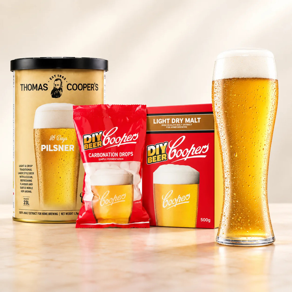 Coopers DIY Thomas Coopers 86 Days Pilsner 5 Gallon Refill with beer glass, carbonation drops, and light dry malt
