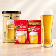 Coopers DIY Thomas Coopers 86 Days Pilsner 5 Gallon Refill with beer glass, carbonation drops, and light dry malt