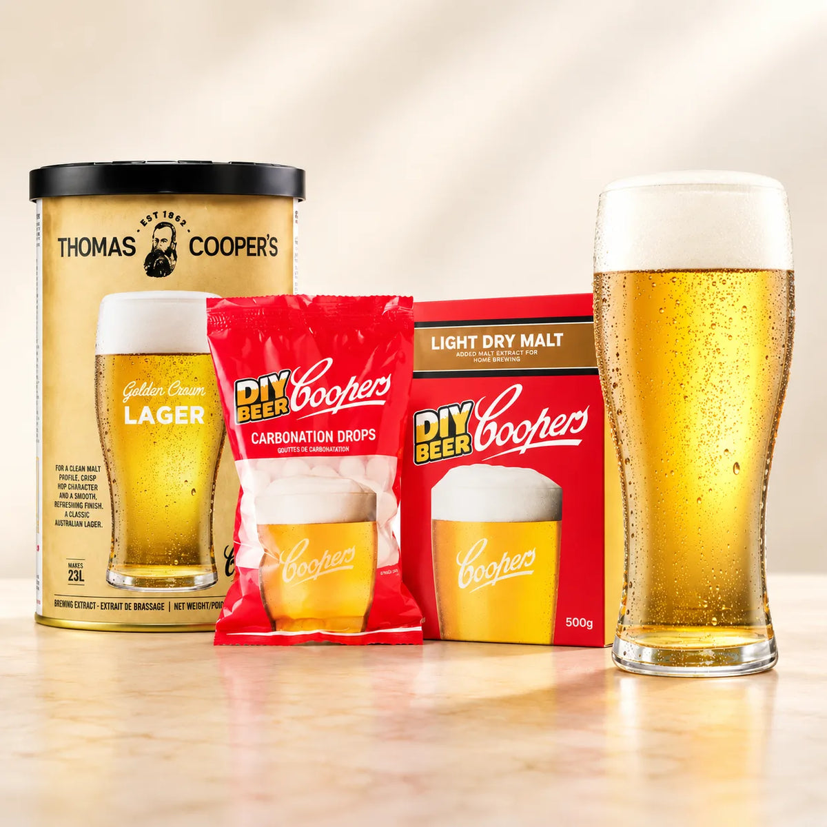 Coopers DIY Thomas Coopers Golden Crown Lager 5 Gallon Refill with beer glass, carbonation drops, and light dry malt