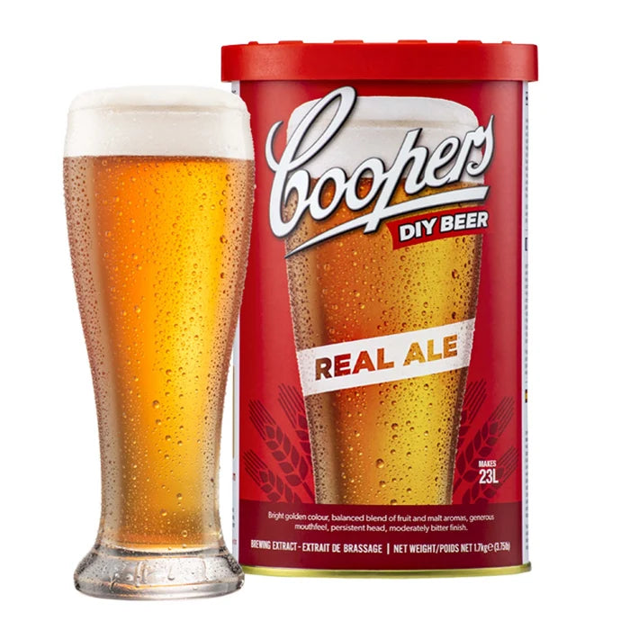 Coopers Real Ale Brewing Extract can with a glass of bright golden traditional ale