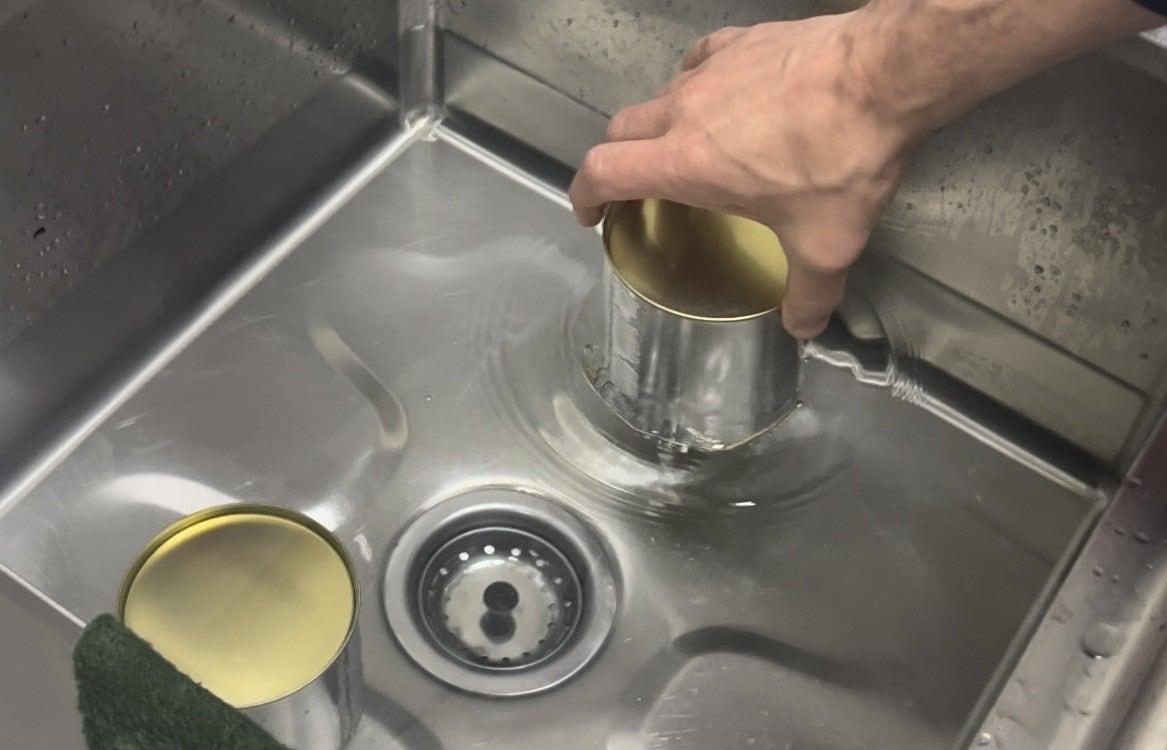 Warming malt extract in a sink